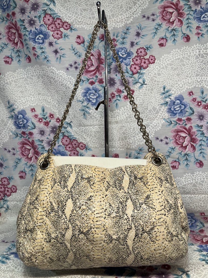 CHARLES & KEITH PYTHON PRINT STUDDED FLAP SHOULDER BAG (Category: Shoulder Bags) located in General Mariano Alvarez. Submitted by adonid (Listing ID 1468994004, Image 2). Description: CHARLES & KEITH PYTHON PRINT STUDDED FLAP SHOULDER BAG GOOD CONDITION NORMAL SIGN OF USAGE ONLY .