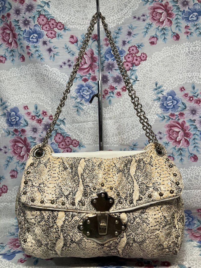CHARLES & KEITH PYTHON PRINT STUDDED FLAP SHOULDER BAG (Category: Shoulder Bags) located in General Mariano Alvarez. Submitted by adonid (Listing ID 1468994004, Image 1). Description: CHARLES & KEITH PYTHON PRINT STUDDED FLAP SHOULDER BAG GOOD CONDITION NORMAL SIGN OF USAGE ONLY .