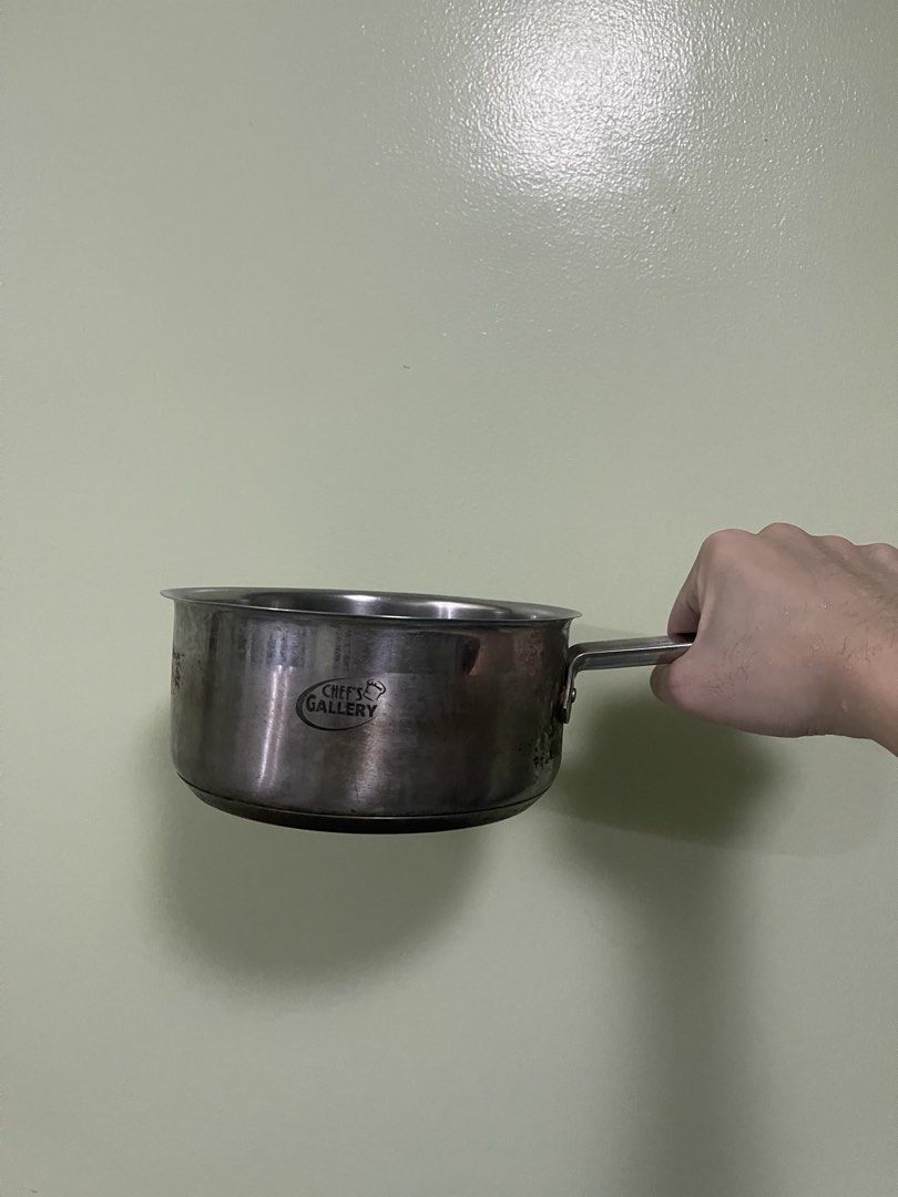 Chef's Gallery Stainless Steel Saucepan (Category: Cookware & Accessories) located in Manila. Submitted by pasaybestfinds (Listing ID 1469069908, Image 1). Description: Chef's Gallery stainless steel saucepan. Features a sturdy handle and round rim. Inner surface shows normal wear with some scratches and stains from previous cooking use. Exterior has the brand logo printed clearly on the side. Solid metal construction, good for daily meal prep..