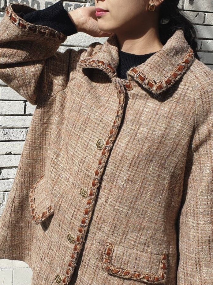 Chic Tweed Coat with Braided Trim and Front Pockets (Category: Coats, Jackets and Outerwear) located in General Santos City (Dadiangas). Submitted by amzonshop (Listing ID 1468997437, Image 3). Description: - Material: Textured tweed in warm camel and brown tones - Design: Contrast braided trim along the collar, placket, and pockets with chic gold-toned buttons - Pockets: Two functional front flap pockets - Fit: Mid-length cut with long sleeves -