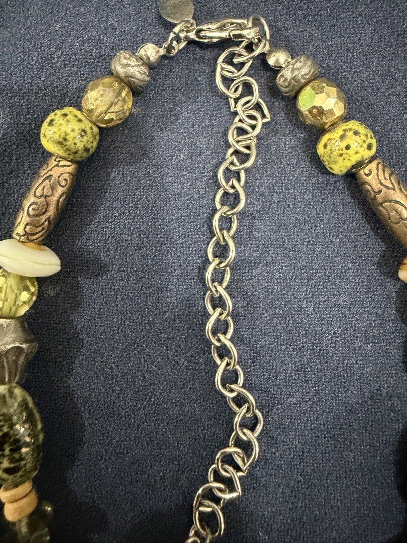 Chico's Statement Necklace with Bamboo and Leaf Pendant (Category: Necklaces) located in Makati City. Submitted by petite_preloved2 (Listing ID 1469064196, Image 3). Description: - Brand: Chico's - Design: Earthy green, yellow, and metallic beads with a large rectangular pendant - Details: Silver-toned bamboo frame with gold-toned leaves and clear maker stamp on the back - Closure: Adjustable chain with secure lobster clasp - Condition: Good pre-