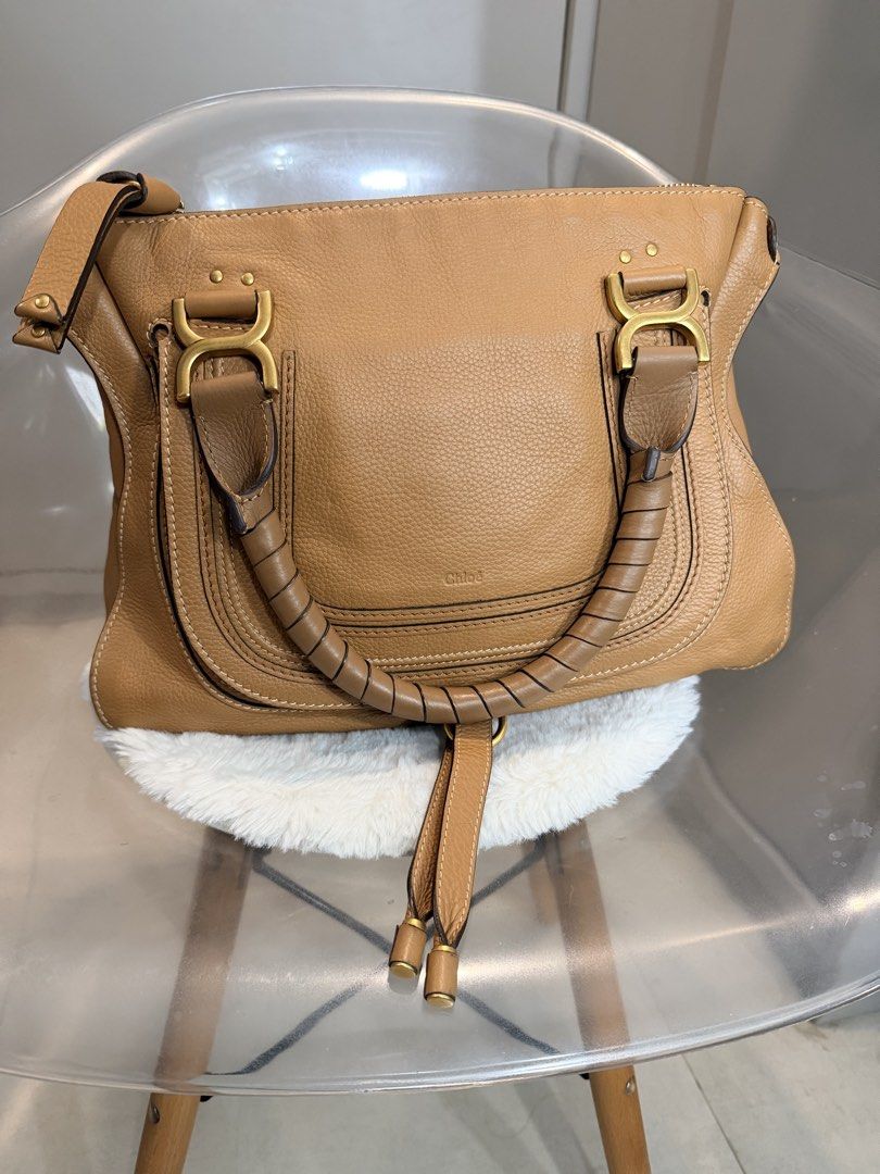 Chloé Marcie Medium Ocre Leather Shoulder Bag (Category: Luxury Bags & Wallets) located in Paranaque City. Submitted by silverforest.13 (Listing ID 1469006976, Image 3). Description: - Authentic Chloé Marcie bag in ochre grained calfskin - Features double wrapped handles, front flap pocket with horseshoe stitching, and gold-tone hardware - Secure top zip closure with fabric-lined interior and zip pocket - Comes complete with original dust bag, ta