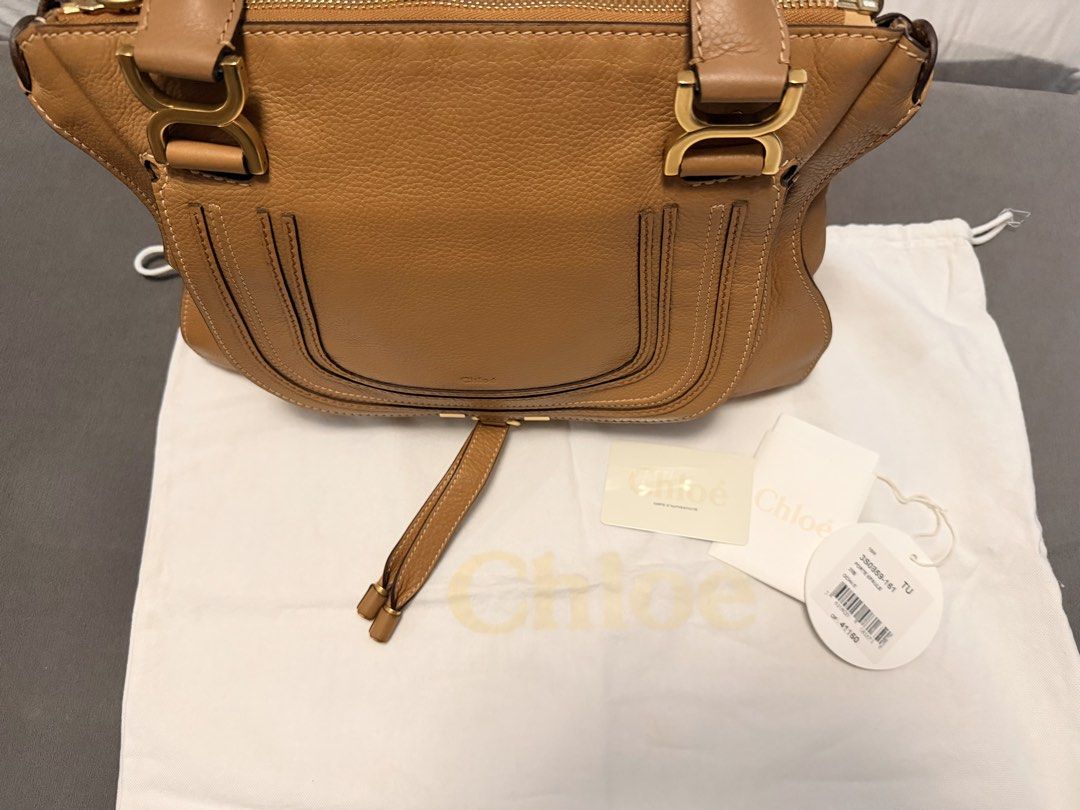 Chloé Marcie Medium Ocre Leather Shoulder Bag (Category: Luxury Bags & Wallets) located in Paranaque City. Submitted by silverforest.13 (Listing ID 1469006976, Image 2). Description: - Authentic Chloé Marcie bag in ochre grained calfskin - Features double wrapped handles, front flap pocket with horseshoe stitching, and gold-tone hardware - Secure top zip closure with fabric-lined interior and zip pocket - Comes complete with original dust bag, ta