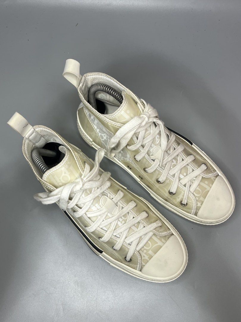 Christian Dior B23 High-Top Sneaker (Category: Sneakers & Footwear) located in Lala. Submitted by adrian.885 (Listing ID 1469131889, Image 2). Description: Christian Dior B23 High-Top Sneaker in an ivory, white, and beige Oblique motif with a transparent mesh and PVC panel design. OPEN FOR RESERVATION FOR 15 days Down payment 350 pesos CODED X SOLID MATERIAL NO ISSUE X GOOD AS NEW.