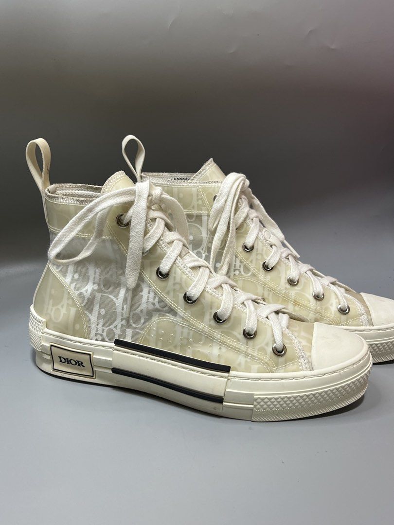 Christian Dior B23 High-Top Sneaker (Category: Sneakers & Footwear) located in Lala. Submitted by adrian.885 (Listing ID 1469131889, Image 1). Description: Christian Dior B23 High-Top Sneaker in an ivory, white, and beige Oblique motif with a transparent mesh and PVC panel design. OPEN FOR RESERVATION FOR 15 days Down payment 350 pesos CODED X SOLID MATERIAL NO ISSUE X GOOD AS NEW.