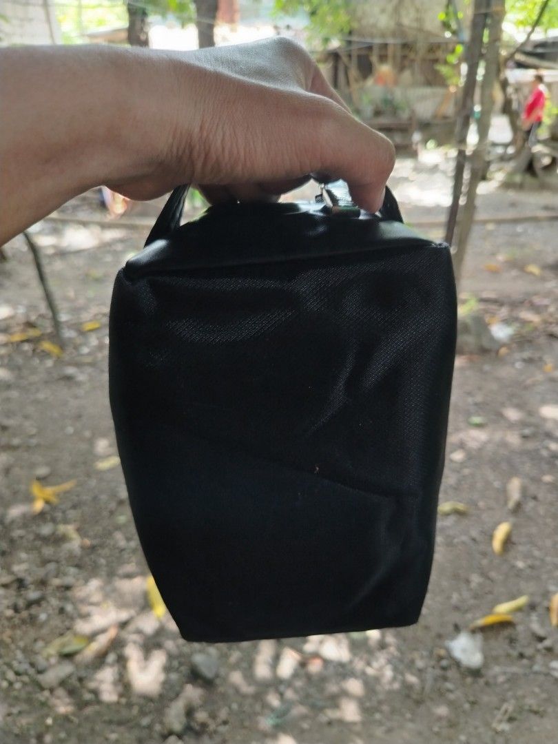 Christian Dior Black Toiletry Bag (Category: Luxury Bags & Wallets) located in Caloocan City. Submitted by vincefresn21903 (Listing ID 1468955715, Image 2). Description: Black Christian Dior pouch with dual zippered compartments. Sturdy nylon and faux leather material. Compact size for daily essentials or travel gear. Debossed Dior logo on the front panel. Wrist strap attached on the side. Silver tone hardware zippers work smoothly..