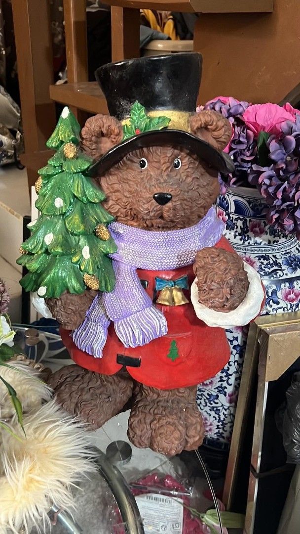 Christmas Teddy Bear Figurine with Tree and Top Hat (Category: Figurines & Statues) located in Manila. Submitted by supermom888 (Listing ID 1468988744, Image 1). Description: - Festive Christmas teddy bear figurine holding a small green tree - Dressed in a black top hat with holly, purple knitted scarf, and red coat with gold bell buttons - Made of durable, textured brown resin material - Designed to stand upright easily - Perfect holiday decor p