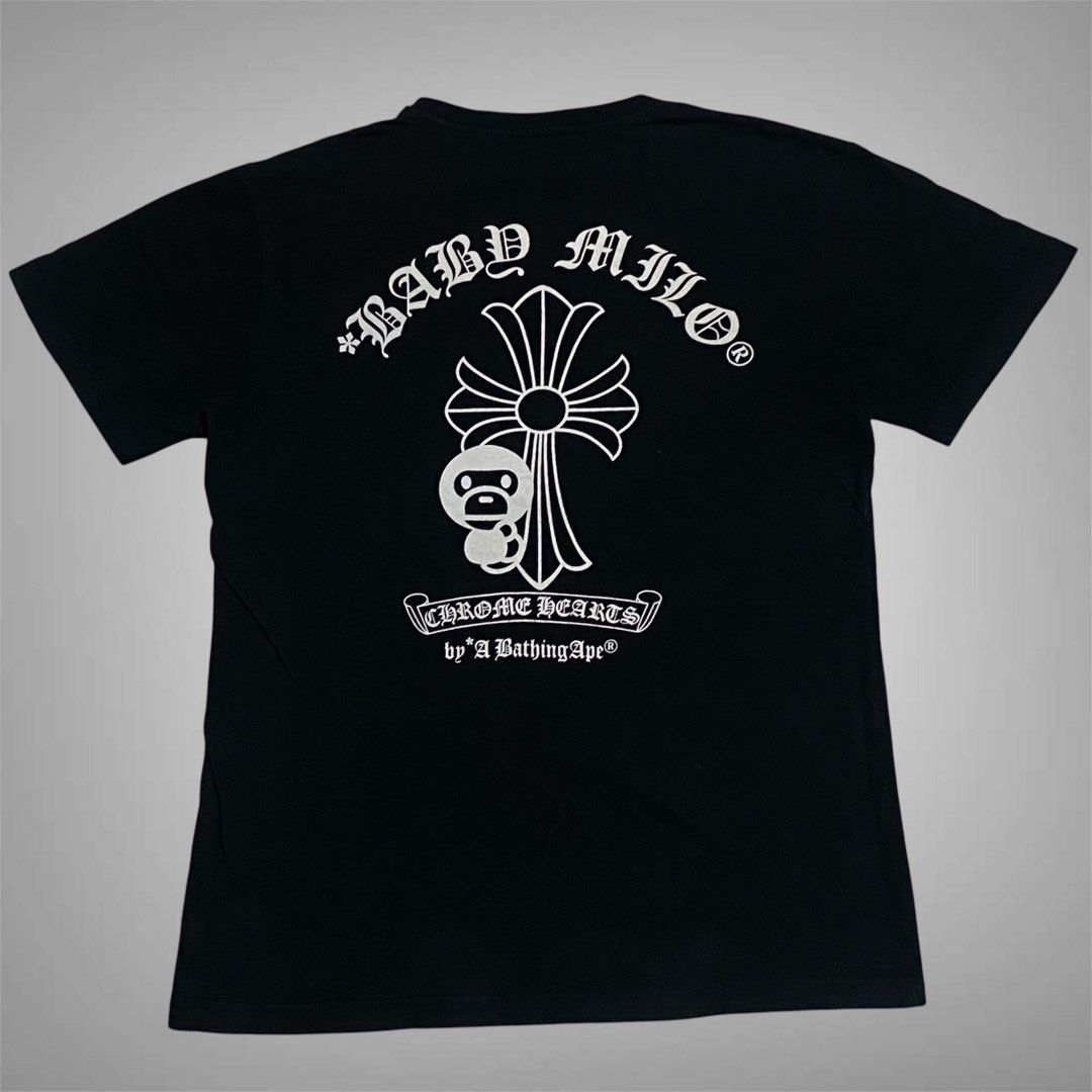 Chrome Heart x A Bathing Ape (Category: Shirts) located in Mabalacat. Submitted by stellargarments (Listing ID 1468975333, Image 1). Description: no tags Length : 25 Width : 19 Condition : 9/10 smooth pa tela very comfy & smooth on skin minimal hairline sa harap sa likod 5hairline lang medjo lukot pa po need wash fresh from bale color may vary due to lighting.