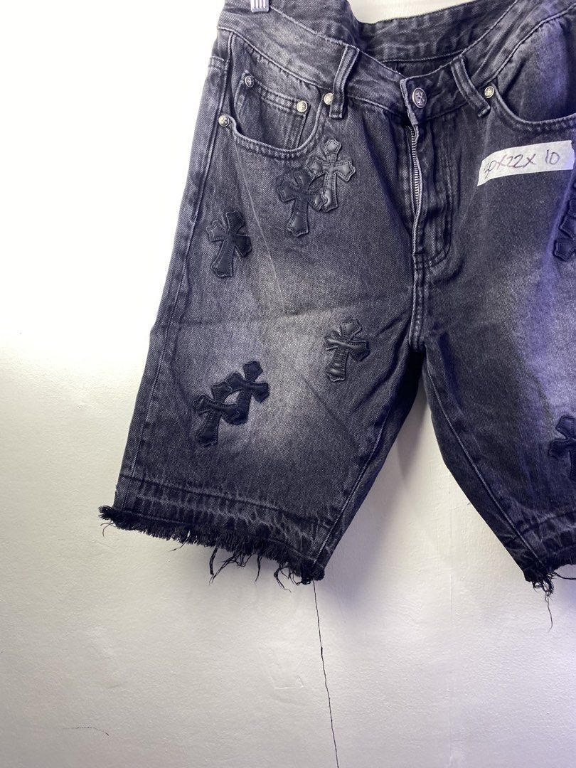 Chrome Hearts Black Denim Cross Patch Shorts (Category: Shorts) located in Manila. Submitted by declutterpromax (Listing ID 1469002138, Image 3). Description: - Brand: Chrome Hearts - Style: Black washed denim shorts with distressing and frayed raw hems - Detailing: Signature leather cross patches on front and back panels - Hardware: Silver-tone hardware and branded buttons throughout - Fit: Straight fit, knee-length cut - Condition: Solid piece 