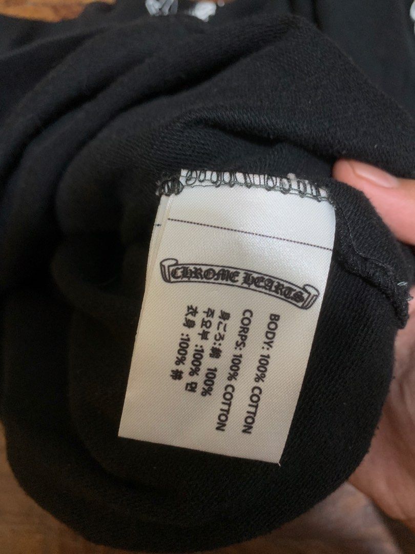 Chrome Hearts x A Bathing Ape Hoodie (Category: Hoodies) located in Manila. Submitted by seanwinstn (Listing ID 1469063416, Image 3). Description: - PRICE IS A LITTLE NEGOTIABLE + SF -Brand: Chrome Hearts x A Bathing Ape - Color: Black - Size: Small on tag (fits Medium to Large comfortably) - Material: 100% heavy cotton, Made in U.S.A. - Design Details: Red Aape branding on the hood, graphic prints along both sleeves, and a large statement logo o