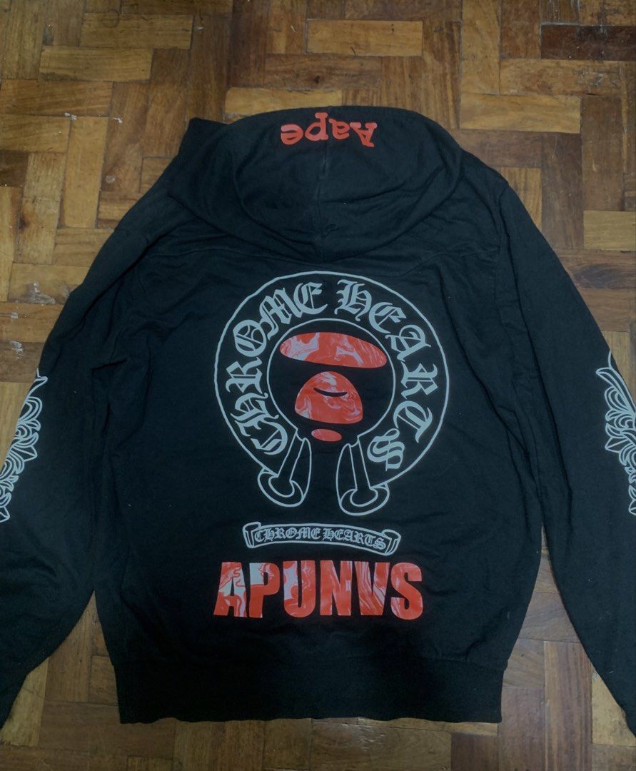 Chrome Hearts x A Bathing Ape Hoodie (Category: Hoodies) located in Manila. Submitted by seanwinstn (Listing ID 1469063416, Image 2). Description: - PRICE IS A LITTLE NEGOTIABLE + SF -Brand: Chrome Hearts x A Bathing Ape - Color: Black - Size: Small on tag (fits Medium to Large comfortably) - Material: 100% heavy cotton, Made in U.S.A. - Design Details: Red Aape branding on the hood, graphic prints along both sleeves, and a large statement logo o