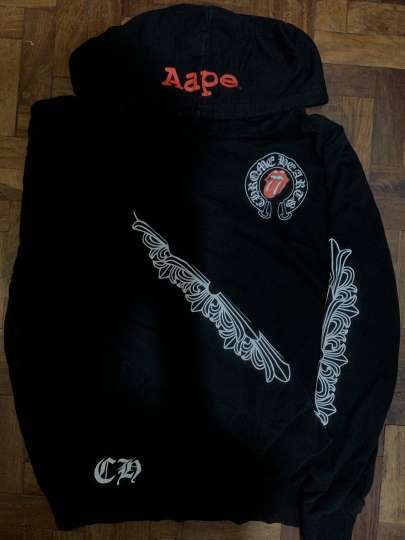 Chrome Hearts x A Bathing Ape Hoodie (Category: Hoodies) located in Manila. Submitted by seanwinstn (Listing ID 1469063416, Image 1). Description: - PRICE IS A LITTLE NEGOTIABLE + SF -Brand: Chrome Hearts x A Bathing Ape - Color: Black - Size: Small on tag (fits Medium to Large comfortably) - Material: 100% heavy cotton, Made in U.S.A. - Design Details: Red Aape branding on the hood, graphic prints along both sleeves, and a large statement logo o
