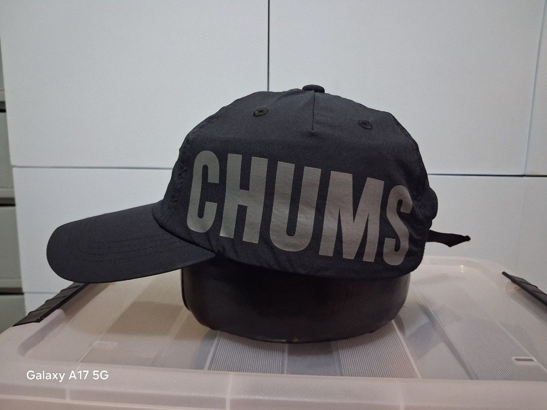 CHUMS CH05-1279 Black Cap (Category: Caps & Hats) located in Imus. Submitted by jefflac54673 (Listing ID 1468937379, Image 2). Description: - Authentic CHUMS black cap (Model: CH05-1279) - Made in China with clean overall condition and intact inner tags - Free size with adjustable strap closure for a customized fit - Features a large CHUMS logo printed on the side and a small embroidered logo patch on the front - Made of a durable and comfortable