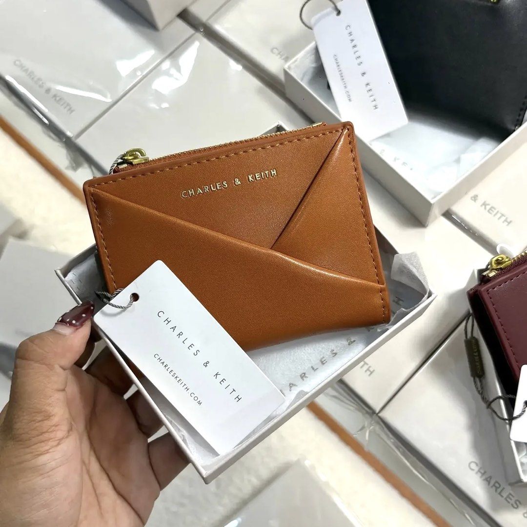 C&K Midori Geometric Small Wallet (Category: Wallets & Card holders) located in Bulacan. Submitted by mykakarizza (Listing ID 1469074262, Image 2). Description: NEW✨✨ ₱500 with box C&K Midori Geometric Small Wallet 1 Note Compartment(s) 1 Zip Compartment(s) 10 Card Slot(s) Width 11.3 cm Depth 2 cm Height 9 cm 📸 Actual pics! 🙋🏻‍♀️ ─── ✦ ─── ✦ ─── ✦ ─── ✦ ─── 🛍️ LOOKING FOR MORE RESELLERS 🛍️ ✨ Buy 3 pcs of ANY items — FREE SHIPPING NA!🚚 ✨ Buy