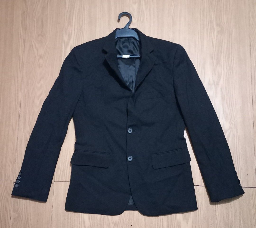 Classic Black Two-Button Suit coat for men (Category: Coats, Jackets and Outerwear) located in Paranaque City. Submitted by jom07 (Listing ID 1468933634, Image 1). Description: Simple black blazer with two front buttons and flap pockets. Fully lined interior and four-button cuffs. Clean minimalist look for formal wear, work, or casual smart outfits. Standard lapel design. Neutral dark shade matches plenty of trousers and shirts..