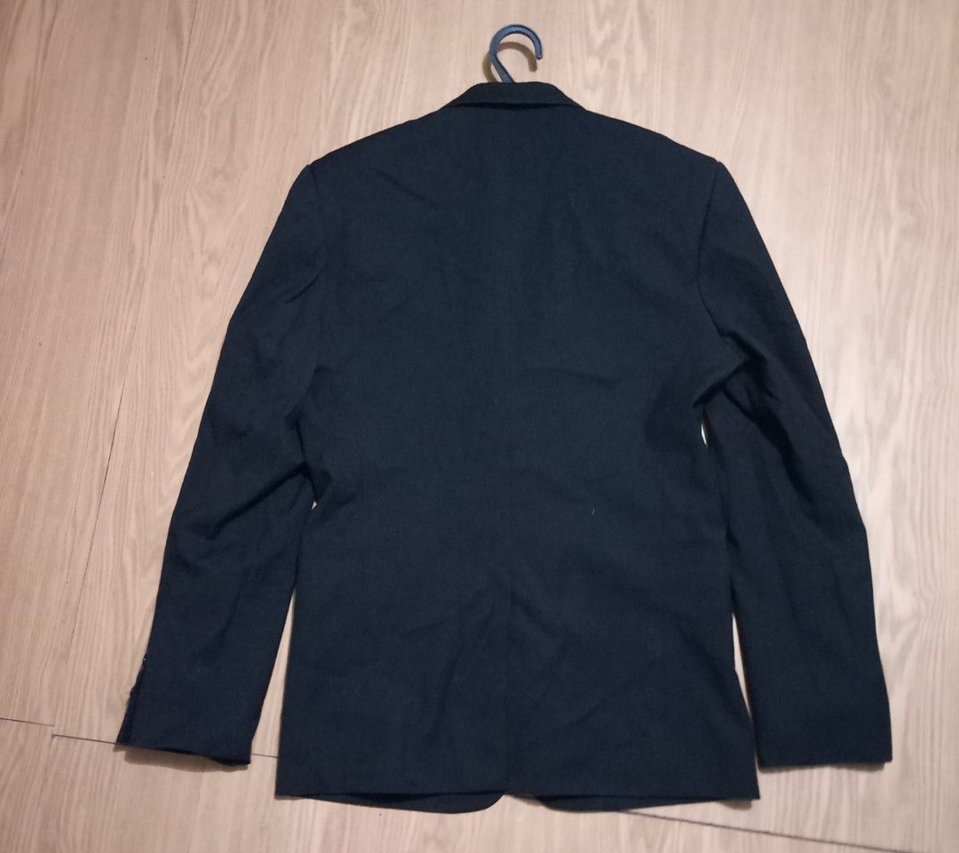 Classic Black Two-Button Suit coat for men (Category: Coats, Jackets and Outerwear) located in Paranaque City. Submitted by jom07 (Listing ID 1468933634, Image 2). Description: Simple black blazer with two front buttons and flap pockets. Fully lined interior and four-button cuffs. Clean minimalist look for formal wear, work, or casual smart outfits. Standard lapel design. Neutral dark shade matches plenty of trousers and shirts..