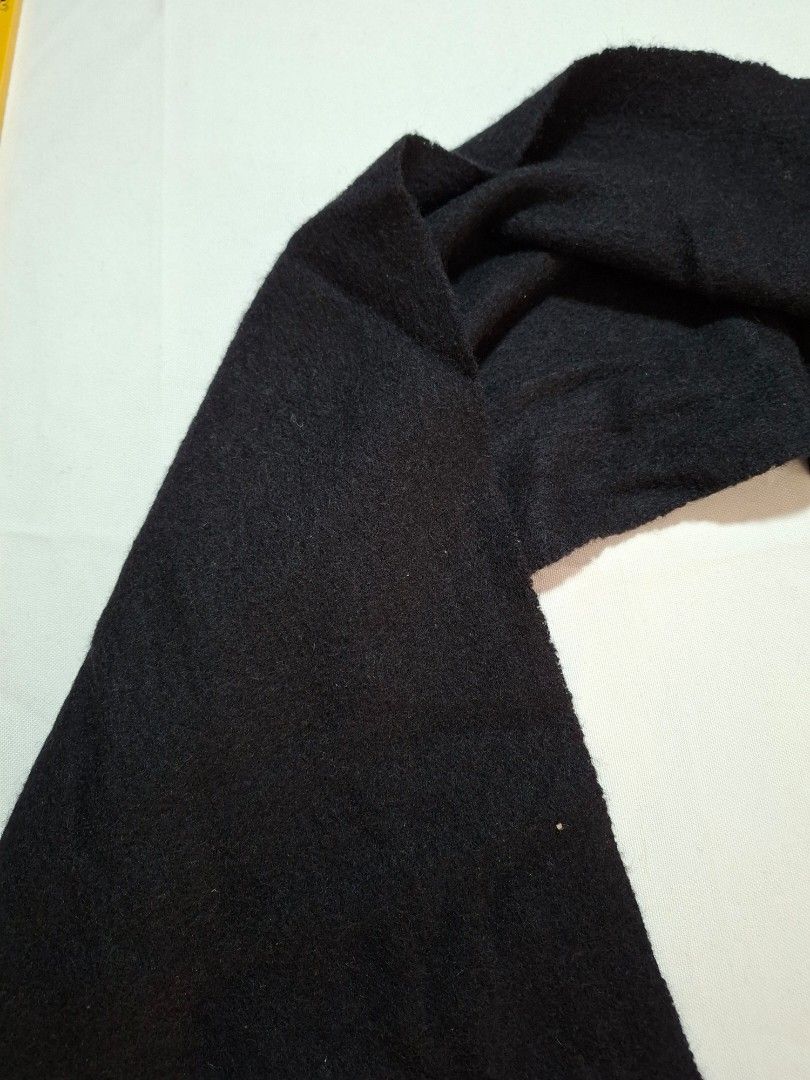 Classic Black Winter Scarf with Fringe (Category: Scarves) located in Baguio. Submitted by restyrille77846 (Listing ID 1469062736, Image 3). Description: - Color: Solid black - Material: Soft wool-like fabric - Size: Approx. 13 inches wide with a great length for wrapping - Design: Classic fringe detailing on both ends - Versatile: Warm, cozy, and easy to pair with any jacket or coat.