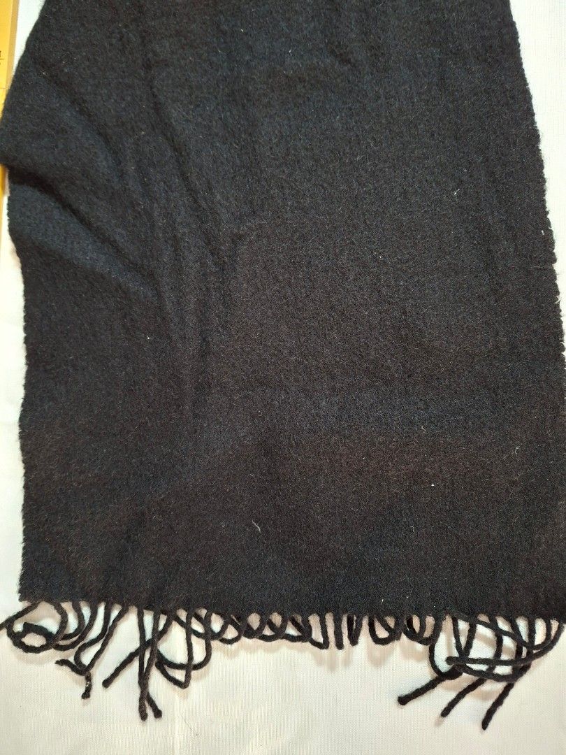 Classic Black Winter Scarf with Fringe (Category: Scarves) located in Baguio. Submitted by restyrille77846 (Listing ID 1469062736, Image 2). Description: - Color: Solid black - Material: Soft wool-like fabric - Size: Approx. 13 inches wide with a great length for wrapping - Design: Classic fringe detailing on both ends - Versatile: Warm, cozy, and easy to pair with any jacket or coat.