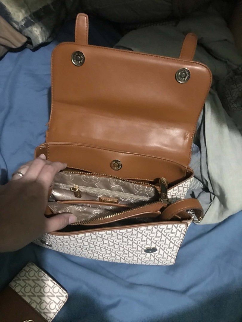CLN Monogram Handbag with Matching Wallet Set (Category: Luxury Bags & Wallets) located in Bacoor. Submitted by rslynfe29 (Listing ID 1469071787, Image 2). Description: Chic CLN handbag and matching wallet set in white and brown monogram with brown faux leather accents. Features gold hardware, a floral clasp, top handle, and multiple compartments to keep you organized. Stylish, functional, and perfect for everyday use..