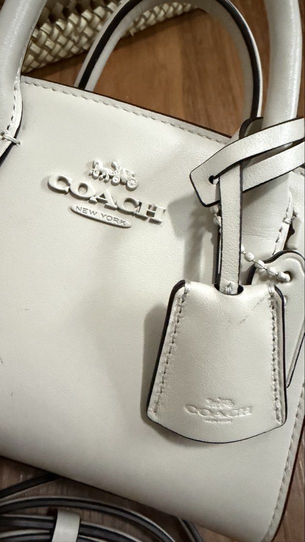 Coach Andrea Mini Carryall Bag (Category: Luxury Bags & Wallets) located in Valenzuela. Submitted by ruichi080607 (Listing ID 1468983475, Image 2). Description: -bought for 22k - Authentic Coach mini tote in crisp white leather with sleek silver hardware - Secure zip-top closure to keep your essentials safe - Versatile design with dual top handles and a detachable crossbody strap - Clean interior featuring a fabric lining and official Coach creed