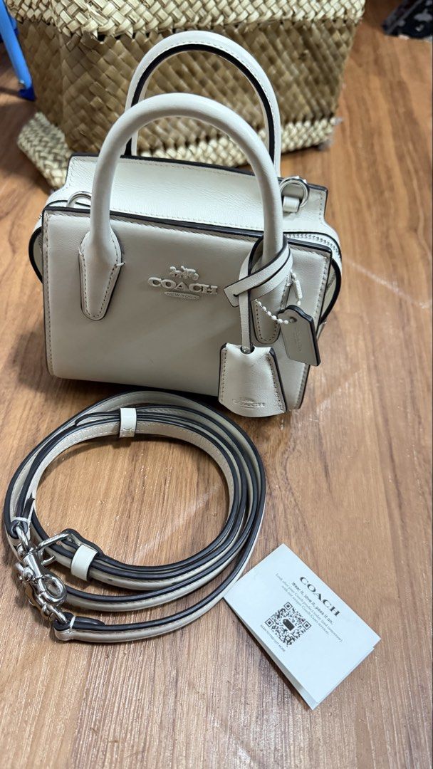 Coach Andrea Mini Carryall Bag (Category: Luxury Bags & Wallets) located in Valenzuela. Submitted by ruichi080607 (Listing ID 1468983475, Image 1). Description: -bought for 22k - Authentic Coach mini tote in crisp white leather with sleek silver hardware - Secure zip-top closure to keep your essentials safe - Versatile design with dual top handles and a detachable crossbody strap - Clean interior featuring a fabric lining and official Coach creed