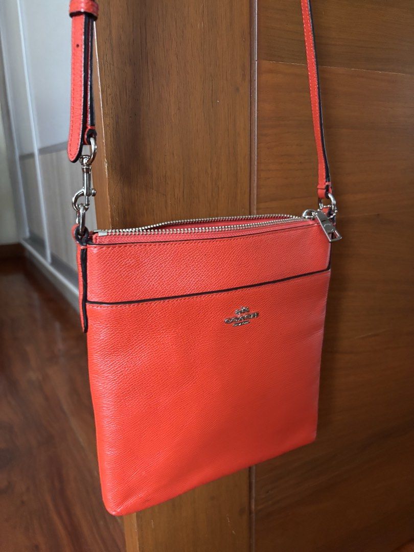 Coach Kitt Messenger Crossbody Bag (Category: Cross-body Bags) located in Quezon City. Submitted by shannon.59 (Listing ID 1468990196, Image 1). Description: • Material: Scratch-resistant, durable crossgrain leather. • Design: A sleek, slim silhouette featuring a secure top-zip closure, a convenient front exterior slip pocket, and the classic Coach metallic lettering logo on the front. • Strap: Detachable and adjustable long leather strap designe
