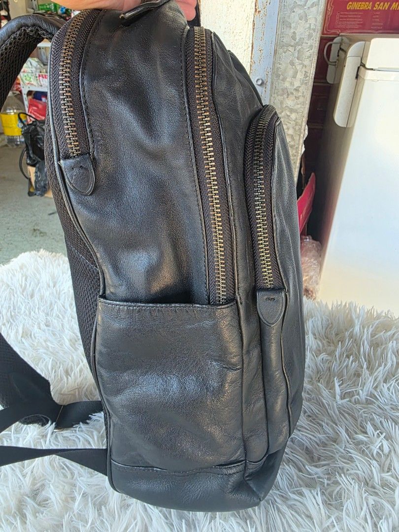 Coach Leather Backpack Black (Category: Backpacks) located in Lemery. Submitted by venus23 (Listing ID 1468931346, Image 3). Description: - Brand: Coach - Color: Classic Black - Material: Premium grain leather with clean exterior texture - Hardware: Sleek silver accents - Storage: Secure zippered front pocket and spacious main compartment - Comfort: Adjustable shoulder straps with breathable mesh back padding - Condition: Excellent everyday carry