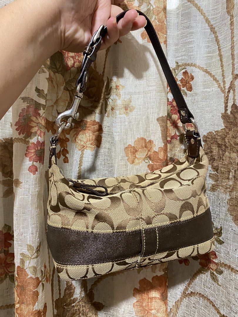 Coach Mini hobo canvas bag (Category: Shoulder Bags) located in Muntinlupa City. Submitted by lovefrenzie (Listing ID 1469102905, Image 3). Description: Brand New condition ❤️ Brown Canvas Bag in mini size Pwede lagyan extender :) Original with ykk zipper and hangtag Please note that this type of coach mini canvas doesn’t have creed. Alabang location .