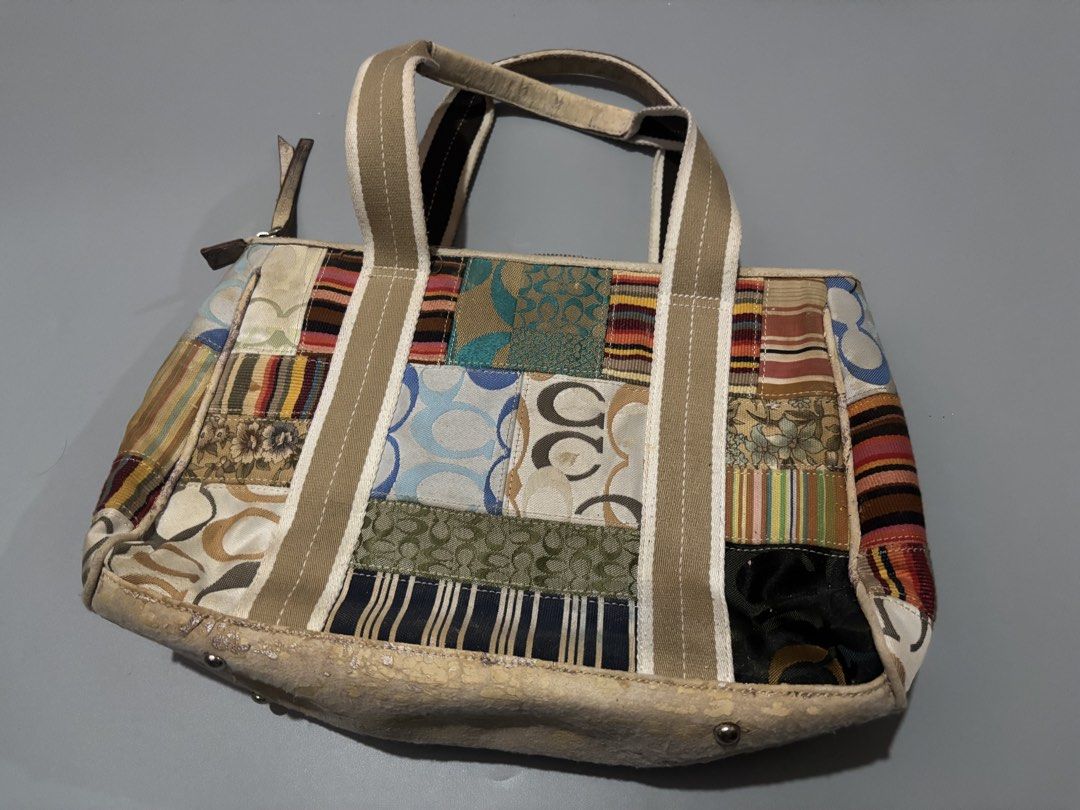 Coach Patchwork Signature C Tote Shoulder Bag (Category: Luxury Bags & Wallets) located in Subic. Submitted by thriftpoison (Listing ID 1468936187, Image 2). Description: Coach signature C patchwork tote bag. Multi-pattern fabric panels combined with beige canvas straps and striped lining inside. Metal feet protect the base. Bottom trim has peeling and cracking throughout. Interior Coach leather creed patch stitched inside. Zipper closure across 