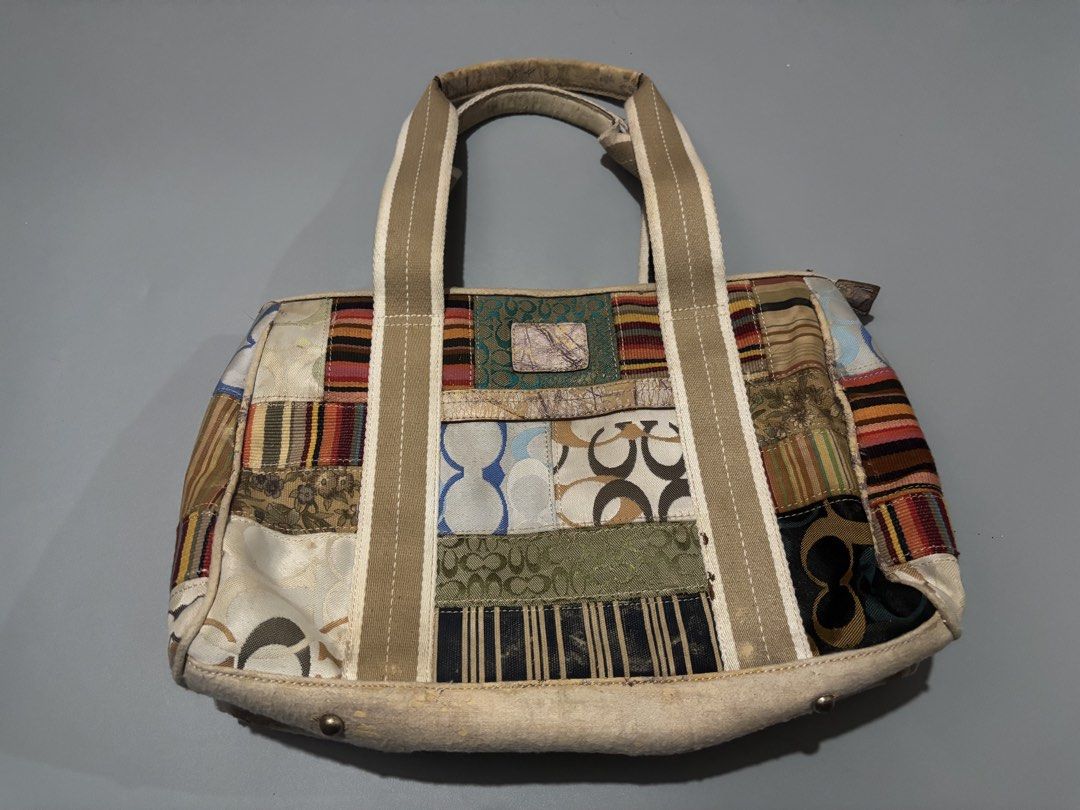 Coach Patchwork Signature C Tote Shoulder Bag (Category: Luxury Bags & Wallets) located in Subic. Submitted by thriftpoison (Listing ID 1468936187, Image 1). Description: Coach signature C patchwork tote bag. Multi-pattern fabric panels combined with beige canvas straps and striped lining inside. Metal feet protect the base. Bottom trim has peeling and cracking throughout. Interior Coach leather creed patch stitched inside. Zipper closure across 