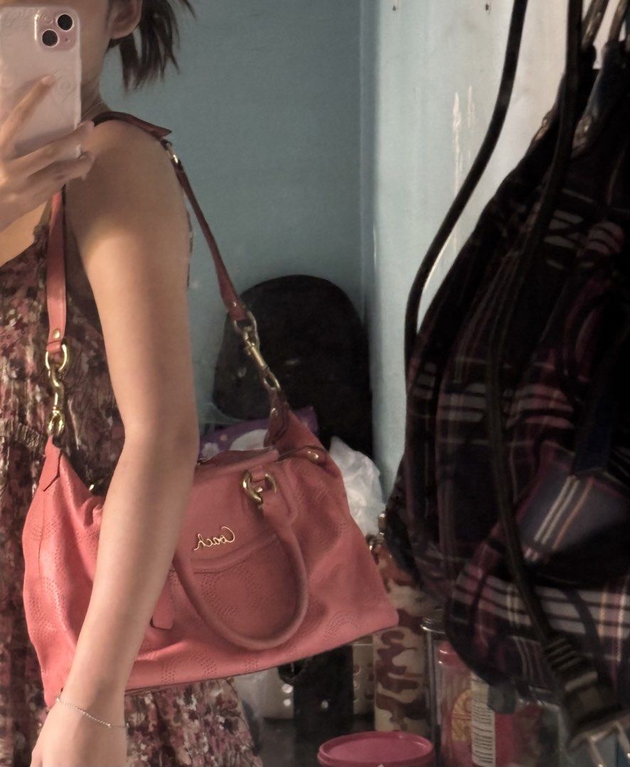 Coach Pink Perforated Leather Satchel (Category: Luxury Bags & Wallets) located in Davao. Submitted by curatedfindx (Listing ID 1469159087, Image 3). Description: PRELOVED with signs of usage. no lowballing jebal :(( rfs decluttering for new things .