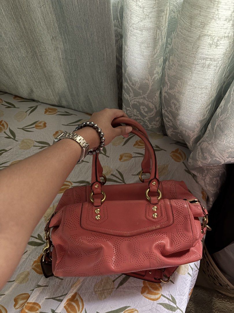 Coach Pink Perforated Leather Satchel (Category: Luxury Bags & Wallets) located in Davao. Submitted by curatedfindx (Listing ID 1469159087, Image 2). Description: PRELOVED with signs of usage. no lowballing jebal :(( rfs decluttering for new things .