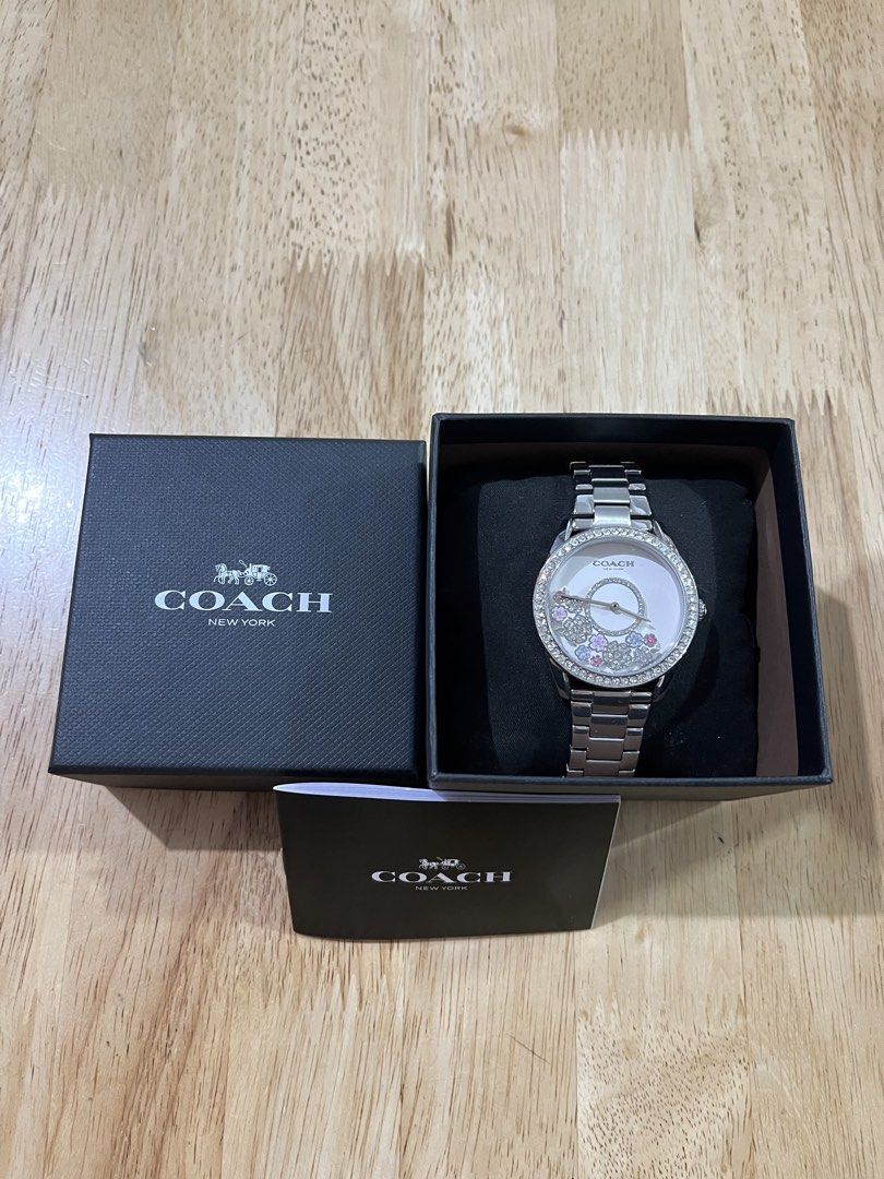 Coach Preston Crystal Accent Watch (Category: Luxury Accessories) located in San Pedro. Submitted by jeikei08 (Listing ID 1469114081, Image 1). Description: • Brand: Coach (Preston Collection) • Model Number: 14503775 • Case Size: 36 mm • Case Material: Stainless steel with crystal-accented bezel • Dial: White sunray dial featuring prairie-inspired crystal floral and circular floating/moving accents • Movement: Quartz • Water Resistance: 3 ATM / 