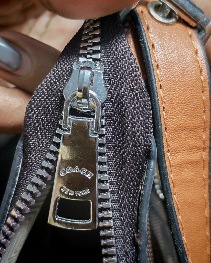 Coach Shoulder Bag Brown Monogram (Category: Luxury Bags & Wallets) located in Caloocan City. Submitted by miyaka_lm (Listing ID 1469087993, Image 3). Description: - Brand: Coach - Style: Shoulder bag - Material: Brown monogram canvas with brown leather handle - Hardware: Silver-tone zippers - Inclusions: Original Coach leather hangtag - Interior: Patterned lining with QR code authenticity tag - Size: Compact, ideal for daily essentials - Conditi