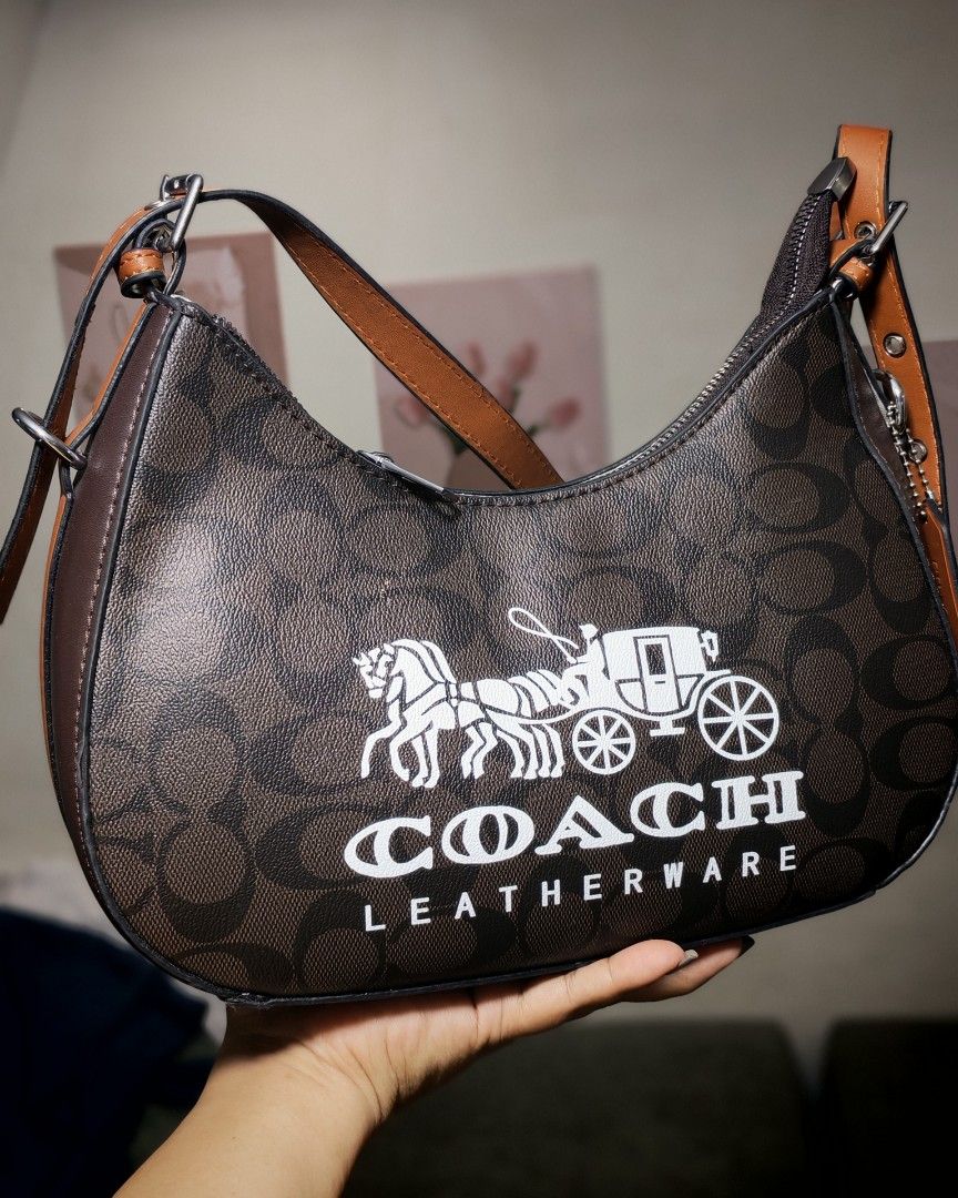 Coach Shoulder Bag Brown Monogram (Category: Luxury Bags & Wallets) located in Caloocan City. Submitted by miyaka_lm (Listing ID 1469087993, Image 2). Description: - Brand: Coach - Style: Shoulder bag - Material: Brown monogram canvas with brown leather handle - Hardware: Silver-tone zippers - Inclusions: Original Coach leather hangtag - Interior: Patterned lining with QR code authenticity tag - Size: Compact, ideal for daily essentials - Conditi