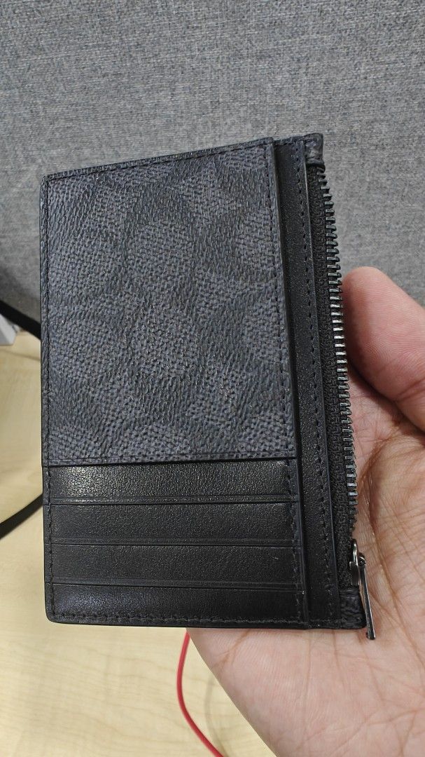 Coach Signature Canvas Zip Card Case Black (Category: Luxury Bags & Wallets) located in Manila. Submitted by _josevicente (Listing ID 1469157592, Image 2). Description: - Brand: Coach - Material: Signature canvas in classic black - Hardware: Gunmetal - Storage: Multiple card slots on one side and a convenient side zippered coin compartment - Design: Compact everyday wallet, sleek and practical Never used. Inspect to appreciate. RFS: Decluttering.