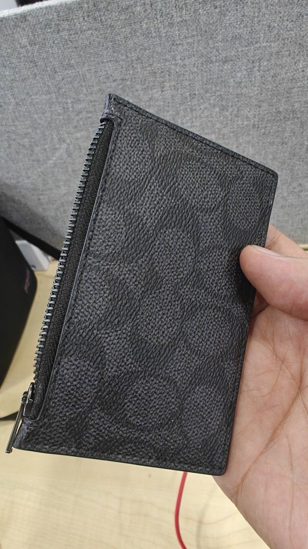 Coach Signature Canvas Zip Card Case Black (Category: Luxury Bags & Wallets) located in Manila. Submitted by _josevicente (Listing ID 1469157592, Image 1). Description: - Brand: Coach - Material: Signature canvas in classic black - Hardware: Gunmetal - Storage: Multiple card slots on one side and a convenient side zippered coin compartment - Design: Compact everyday wallet, sleek and practical Never used. Inspect to appreciate. RFS: Decluttering.