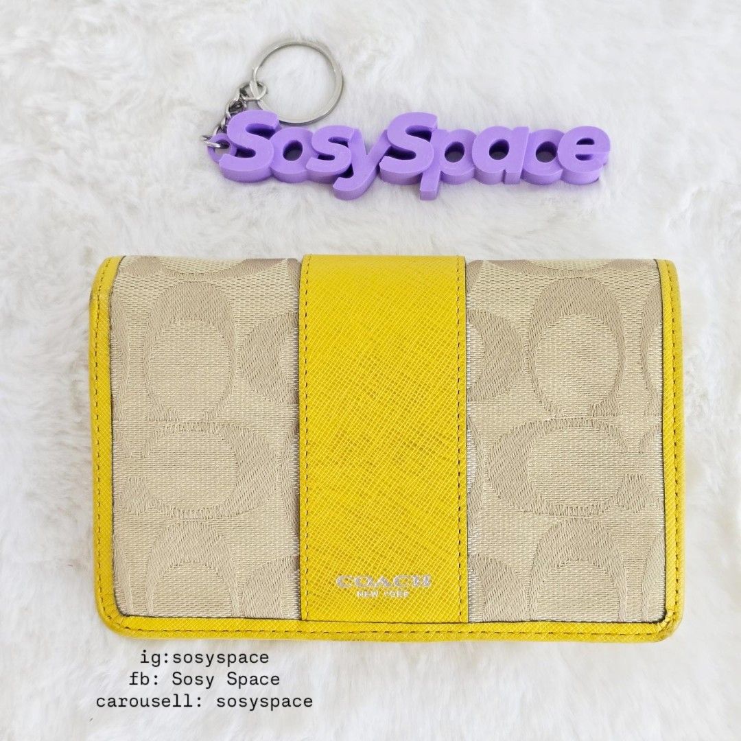 Coach Signature Jacquard Wallet (Category: Luxury Bags & Wallets) located in Lucena. Submitted by sosyspace (Listing ID 1468963552, Image 1). Description: C. O. A. C. H. 01B1P255 Signature Jacquard Bi-fold Wallet Yellow Leather Trim 14.5 x 2.5 x 9.5 cm Condition: PRELOVED has signs of use minor recoloring and cleaning to be pristine no bad odors, no stickiness, no cracking still in very good condition for me for a vintage piece Steal Deal Price: 