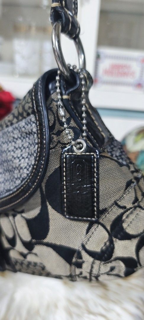 VINTAGE Coach Soho Signature Patchwork Shoulder Bag (Category: Luxury Bags & Wallets) located in Manila. Submitted by shawn0320_fish (Listing ID 1468932617, Image 3). Description: - Authentic Coach signature patchwork shoulder bag - Colorway: Black, grey, and tan canvas with patent leather trim - Hardware: Silver-tone buckle on front flap closure - Strap & Charm: Single black leather shoulder strap with original hanging logo charm - Interior: Pin