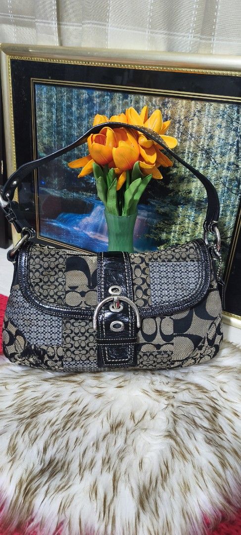 VINTAGE Coach Soho Signature Patchwork Shoulder Bag (Category: Luxury Bags & Wallets) located in Manila. Submitted by shawn0320_fish (Listing ID 1468932617, Image 2). Description: - Authentic Coach signature patchwork shoulder bag - Colorway: Black, grey, and tan canvas with patent leather trim - Hardware: Silver-tone buckle on front flap closure - Strap & Charm: Single black leather shoulder strap with original hanging logo charm - Interior: Pin
