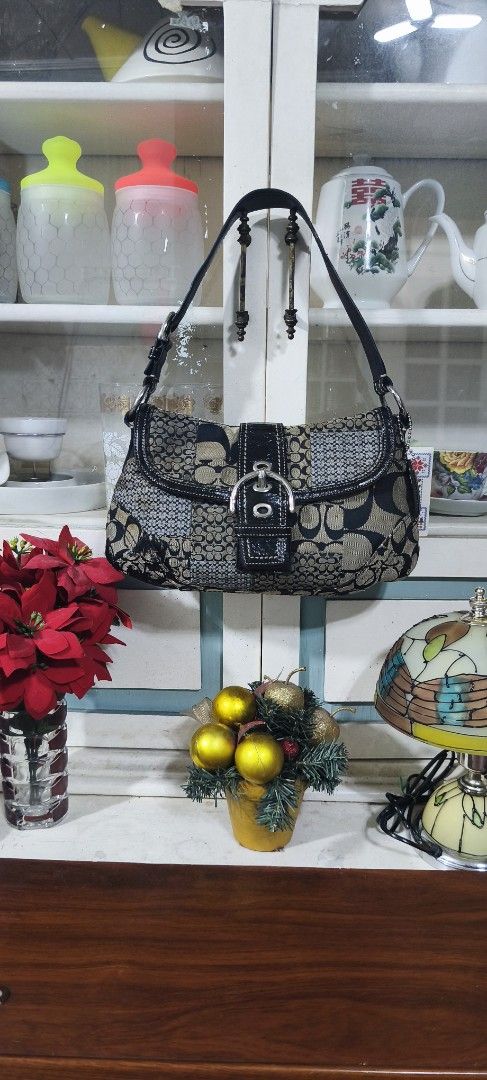 VINTAGE Coach Soho Signature Patchwork Shoulder Bag (Category: Luxury Bags & Wallets) located in Manila. Submitted by shawn0320_fish (Listing ID 1468932617, Image 1). Description: - Authentic Coach signature patchwork shoulder bag - Colorway: Black, grey, and tan canvas with patent leather trim - Hardware: Silver-tone buckle on front flap closure - Strap & Charm: Single black leather shoulder strap with original hanging logo charm - Interior: Pin