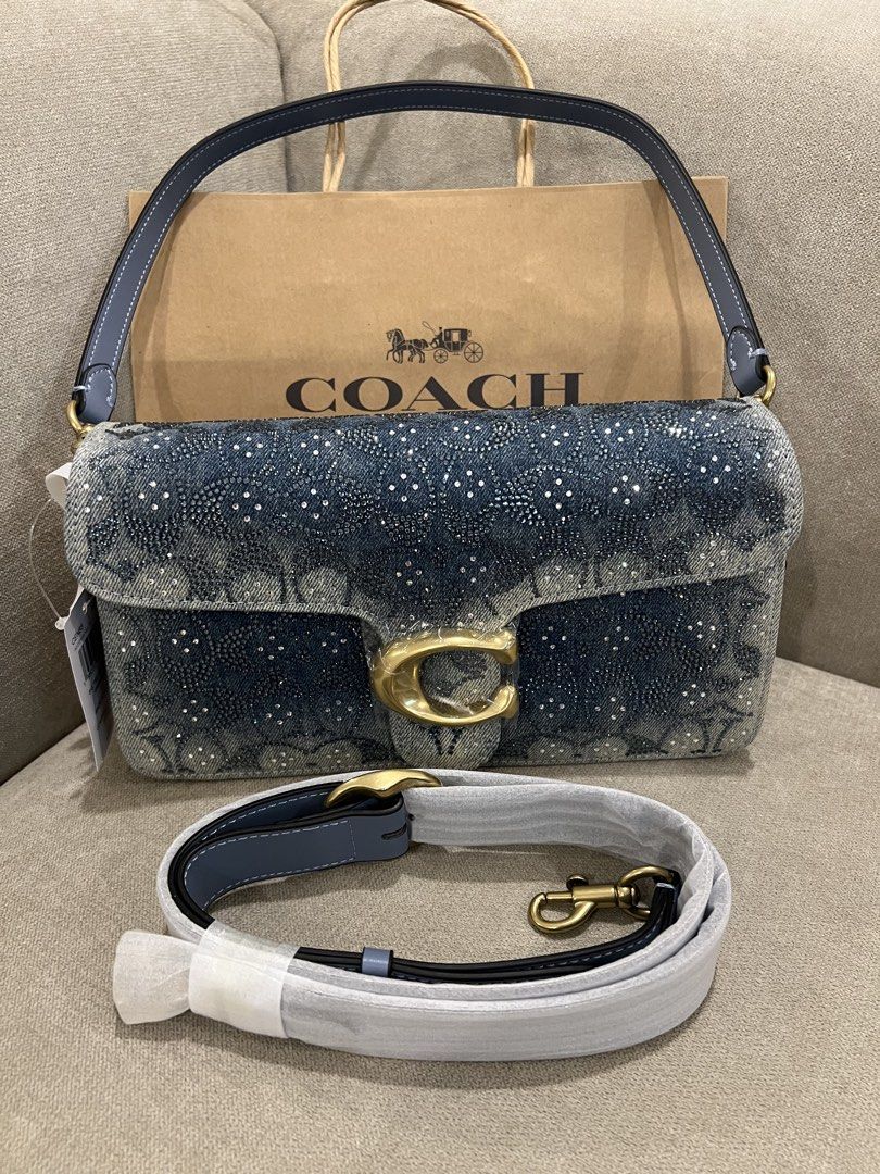 Coach Tabby 26 in Denim Crystal (Category: Luxury Bags & Wallets) located in Manila. Submitted by orsaljoce25536 (Listing ID 1469010596, Image 1). Description: - Brand: Coach - Style: Tabby Shoulder Bag - Material: Blue denim with crystal embellishments and grey-blue leather lining - Hardware: Brass with iconic C clasp - Interior: Structured with multiple compartments - Condition: Brand new with store tags attached - Inclusions: Original detachab
