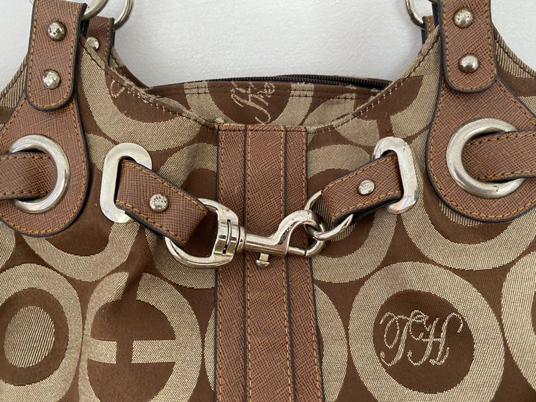 co@ch inspired bag (Category: Shoulder Bags) located in Santa Rosa. Submitted by anghjklica (Listing ID 1469052678, Image 1). Description: Cute brown patterned handbag with ring details and a buckle accent. A stylish vintage-inspired piece perfect for casual outings and everyday use. In good condition! Issue: rusting sa metalware Price: 280+sf.