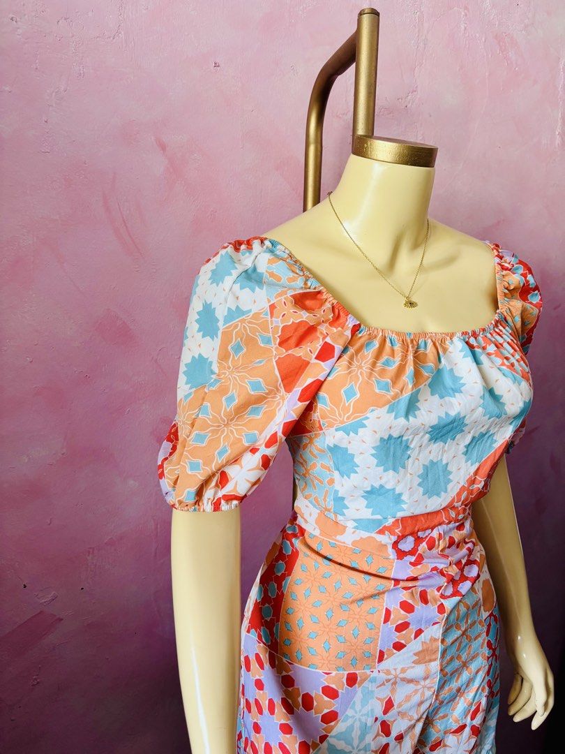 Colorful geometric patchwork square neck romper (Category: Rompers) located in Lipa City. Submitted by classyces24 (Listing ID 1469049363, Image 2). Description: - Vibrant patchwork tile print in orange, blue, red, and purple - Square neckline with comfortable elastic gathering - Fitted waistline with attached shorts for an effortless look - Lightweight and breezy fabric, perfect for hot weather - Easy slip-on style for quick and stylish dressing