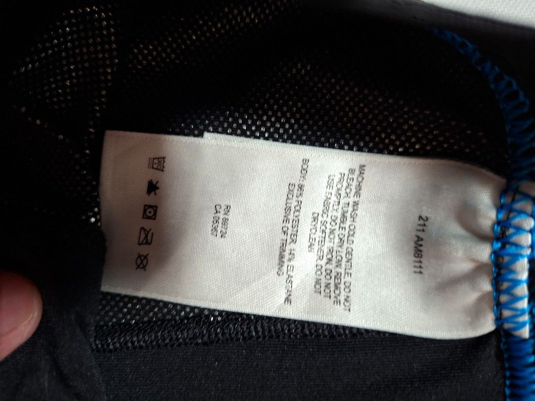 Columbia Black thermal leggings base layer men size M (Category: Activewear) located in Baguio. Submitted by restyrille77846 (Listing ID 1468977929, Image 3). Description: - Color: Black with stylish blue accent stitching - Material: Moisture-wicking fabric (86% polyester, 14% elastane) - Waistband: Elastic with 'Make Your Own Heat' lettering - Size: Measures approx. 13.5 inches across the waist (flat) - Condition: Good overall condition, minor f