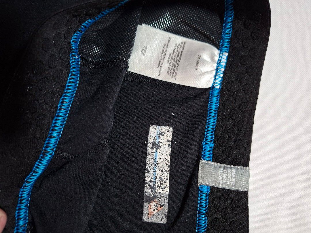 Columbia Black thermal leggings base layer men size M (Category: Activewear) located in Baguio. Submitted by restyrille77846 (Listing ID 1468977929, Image 2). Description: - Color: Black with stylish blue accent stitching - Material: Moisture-wicking fabric (86% polyester, 14% elastane) - Waistband: Elastic with 'Make Your Own Heat' lettering - Size: Measures approx. 13.5 inches across the waist (flat) - Condition: Good overall condition, minor f