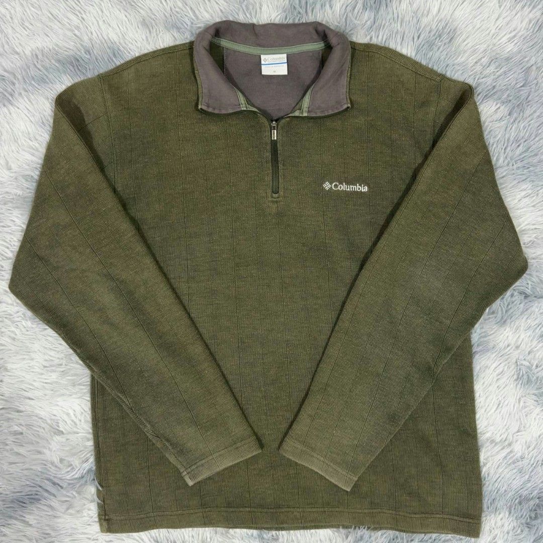 Columbia Green 1/4 Zip Pullover Fleece Sweater (Category: Coats, Jackets and Outerwear) located in Manila. Submitted by gemfinds650 (Listing ID 1469028214, Image 1). Description: - Brand: Columbia - Style: Quarter-zip pullover sweater with high collar - Color: Olive green (earthy neutral tone) - Material: Textured ribbed knit fabric - Details: Small white embroidered Columbia logo on the chest - Fit: Comfortable and versatile everyday layer.
