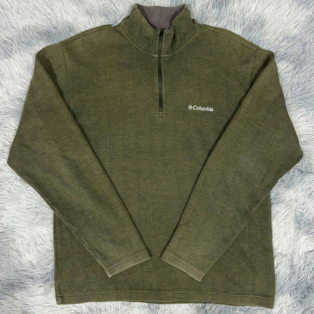 Columbia Green 1/4 Zip Pullover Fleece Sweater (Category: Coats, Jackets and Outerwear) located in Manila. Submitted by gemfinds650 (Listing ID 1469028214, Image 2). Description: - Brand: Columbia - Style: Quarter-zip pullover sweater with high collar - Color: Olive green (earthy neutral tone) - Material: Textured ribbed knit fabric - Details: Small white embroidered Columbia logo on the chest - Fit: Comfortable and versatile everyday layer.