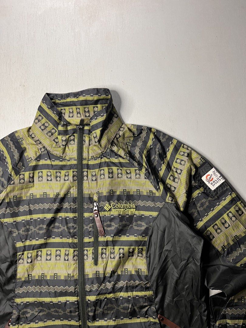 Columbia Sportswear Aztec Pattern Windbreaker Jacket (Category: Coats, Jackets and Outerwear) located in Catbalogan. Submitted by yellfindss (Listing ID 1469132518, Image 2). Description: - Brand: Columbia Sportswear -19/25 - Design: Aztec pattern with contrasting black side panels and retro sleeve patch - Type: Lightweight windbreaker jacket - Features: Full-zip closure, zippered chest pocket, high collar - Condition: Excellent pre-owned conditi