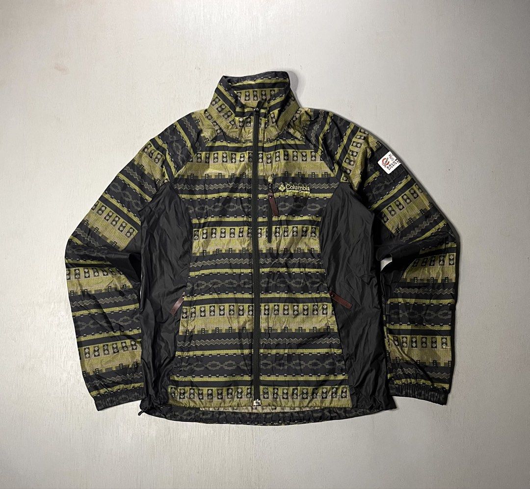 Columbia Sportswear Aztec Pattern Windbreaker Jacket (Category: Coats, Jackets and Outerwear) located in Catbalogan. Submitted by yellfindss (Listing ID 1469132518, Image 1). Description: - Brand: Columbia Sportswear -19/25 - Design: Aztec pattern with contrasting black side panels and retro sleeve patch - Type: Lightweight windbreaker jacket - Features: Full-zip closure, zippered chest pocket, high collar - Condition: Excellent pre-owned conditi
